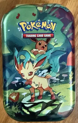 Pokemon TCG: Prismatic Evolutions Mini Tin(Leafeon & Eevee)EMPTY & Jumbo Coin - Image 1