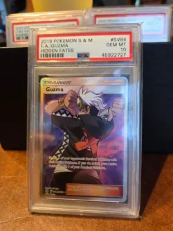 POKEMON SUN & MOON HIDDEN FATES #SV84 Shiny Vault Guzma Full Art - PSA 10 - Image 1