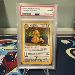 1999 POKEMON FOSSIL #4 DRAGONITE-HOLO PSA 8 - Image 1