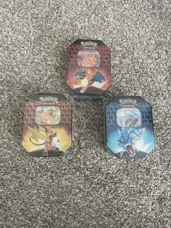 Pokemon - Hidden Fates - Lot of 3 Tins - Charizard, Raichu, Gyarados - Sealed - Image 1