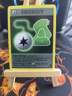 Pokemon TCG Potion Energy Team Rocket 82/82 Regular LP. - Image 1