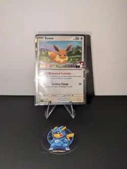 Play! Pokemon Prize Pack Series 7 Surging Sparks Cosmo Holo 143/191 Eevee - Image 1