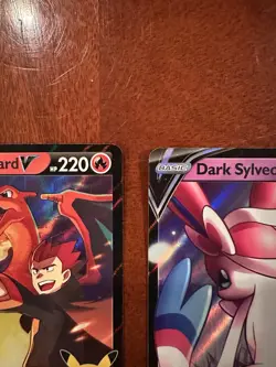 Pokemon Celebrations Lance’s Charizard V SWSH133 & Dark Sylveon V SWSH134 Cards - Image 4