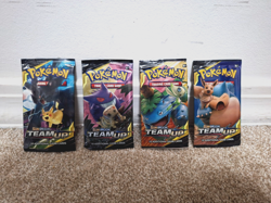 Pokemon Sun and Moon TEAM UP lot of four EMPTY Packs - One of Each Art! - Image 1