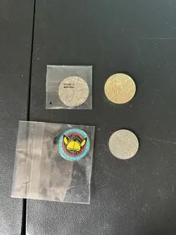 4 metal Pokemon coin lot - Image 1