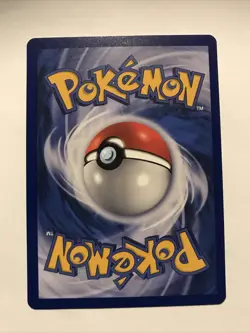 Team Rocket's Meowth Black Star Promo Pokemon Card #18 - Image 2
