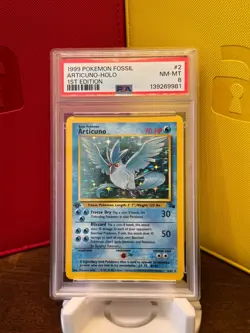 1999 POKEMON FOSSIL 1ST EDITION #2 ARTICUNO-HOLO PSA 8 - Image 1