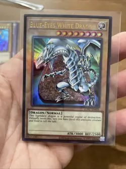 Blue-Eyes White Dragon LCKC-EN001 Unlimited Ultra Rare NearMint +Bonus( vers. 3) - Image 1