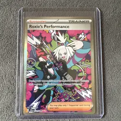 Roxie's Performance 121/086 Me04: Chaos Rising Holo Pokemon TCG Card Rare Art - Image 1