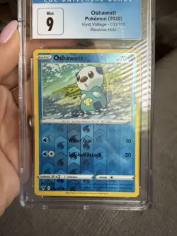CGC 9 Mint Oshawott 033/185 Reverse Holo Vivid Voltage Pokemon Card - Image 1
