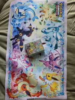 Pokemon Prismatic Evolutions Playing Mat And Card Sleeves - Image 1