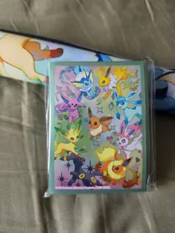 Pokemon Prismatic Evolutions Playing Mat And Card Sleeves - Image 2