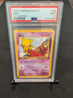Pokemon - 1st Edition Abra - 2000 WOTC Team Rocket - PSA 9 - Image 1
