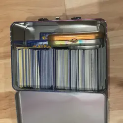 Pokemon tin with mystery cards - Image 2