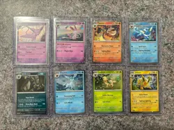 Pokemon Prismatic Evolutions Costco Cosmos Holo Eevee Evolution Set Of 8 Swirls - Image 1
