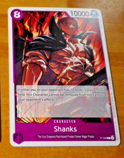 ONE PIECE CARD GAME PROMO CARTE ENGLISH SHANKS P-104 EN JCC MINT - Image 1