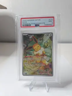Pokemon Prismatic Evolutions ETB Black Star Promo Eevee SVP 173 PSA 9 - Image 1