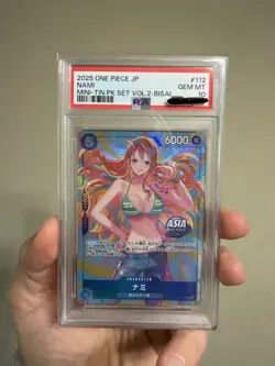 2025 ONE PIECE JAPANESE MINI-TIN PACK SET VOL.2 BISAI #112 NAMI PSA 10 - Image 1