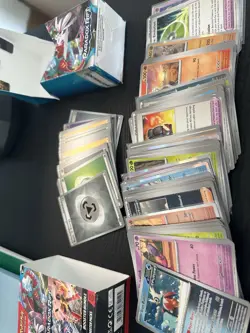 Pokemon TCG Assorted Bulk: OG Tin + Booster Bundle Filled With Bulk Cards - Image 1