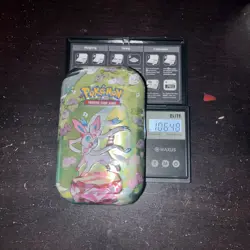 HEAVY 106.48g Pokemon Prismatic Mini Tin Sealed - Image 1