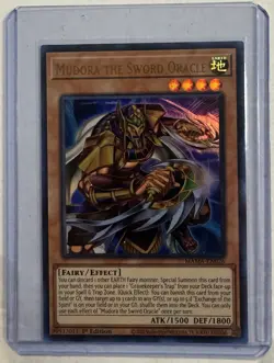 YuGiOh! - Mudora The Sword Oracle MAMA-EN026 Ultra Rare 1st Edition Near Mint - Image 1