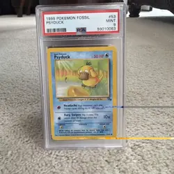 1999 Pokemon Fossil Psyduck #53 PSA 9 MINT - Image 1