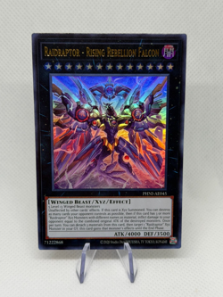 Raidraptor - Rising Rebellion Falcon PHNI-AE045 Ultra Rare AE NM YuGiOh Card - Image 1