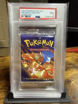 1999 POKEMON SEALED BASE SET UNLIMITED CHARIZARD BOOSTER PACK PSA 9 WITH STAND🔥 - Image 1