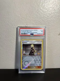 Pokemon 2018 Sun and Moon Cynthia Rev Foil Reg Champ Staff Promo #119 PSA 7 - Image 1