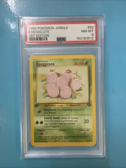 1999 Pokemon Jungle Exeggcute 1st EDITION 52/64 PSA 8 - Image 1