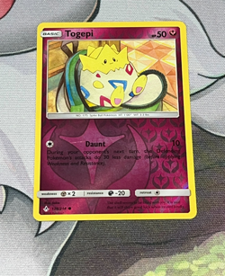 Togepi 136/214 Sm Unbroken Bonds Reverse Holo Pokemon Card NM - Image 1