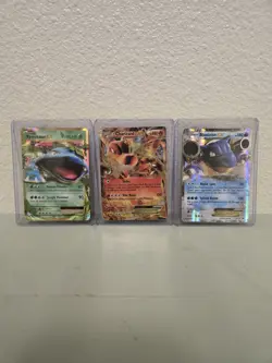 Charzard EX, Venusaur EX, and Blastoise EX TCG Pokemon Cards In Good Condition - Image 1