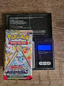 Pokemon Prismatic Evolutions Heavy 23G+ "GOD PACKU" Sealed Booster Pack! - Image 1