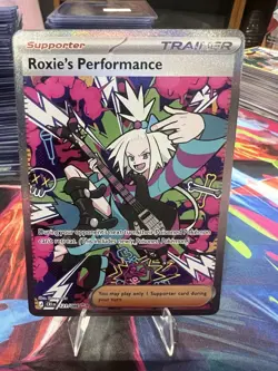 Pokemon Roxie's Performance 121/086 Me04: Chaos Rising Holo - Image 1
