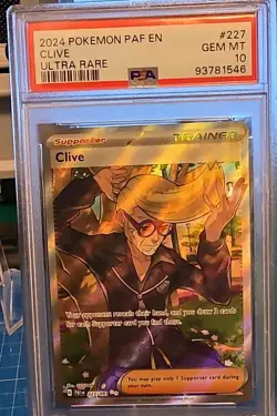 The Pokemon Company Clive 227/091 Paldean Fates Ultra Rare Holo English PSA 10 - Image 1
