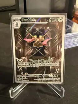 Doublade 098/088 Stage 1 Holo Weapon 100 HP EN Pokemon TCG 2024 - Image 1