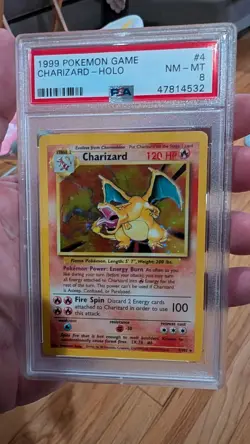 1999 POKEMON BASE SET UNLIMITED #4 CHARIZARD-HOLO PSA 8 - Image 1