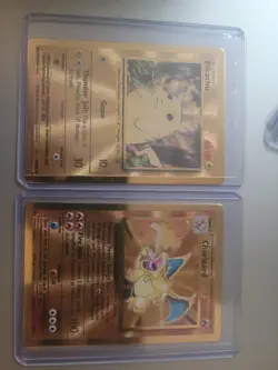 2021 CHARIZARD #4 & PKACHU #58 CELEBRATIONS ULTRA PREMIUM COLLECTION METAL CARDS - Image 1