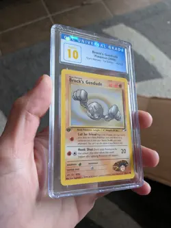 (POP 1) CGC 10 PRISTINE Brock's Geodude 66/132 Gym Heroes Pokemon 1st Edition - Image 1