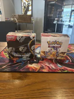 Pokemon Surging Sparks Booster Box And Chaos Rising Booster Box (No Rips) - Image 1