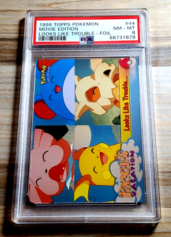 1999 Topps Pokemon Movie Edition LOOKS LIKE TROUBLE #44 Holo Foil PSA 8 NearMint - Image 1