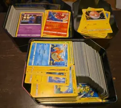 Pokemon TCG Bulk lot in 3 tins 100s of cards - Image 1