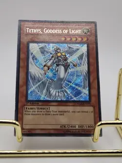 Yugioh Tethys, Goddess of Light CRMS-EN095 Secret Rare 1st Ed Very Light Play - Image 1