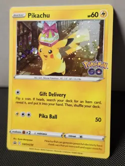 Pikachu SWSH234 NM 2022 Cosmos Holo Black Star Promo Pokemon GO Card - Image 1