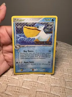 The card is a reverse holo stamped Pelipper 21/107 from EX Deoxys (2005) - Image 1
