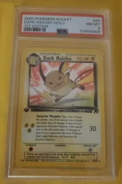 Pokemon 1st Edition Team Rocket Dark Raichu Holo PSA 8 - Image 1