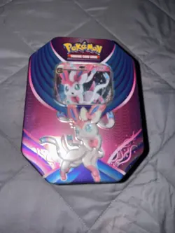 New Sealed Pokemon TCG Sylveon GX Tin With 4 Booster Packs - Image 1