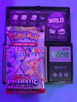 Weighed 22.48g Pokemon TCG Prismatic Evolutions Booster Pack Sealed Heavy Weight - Image 1