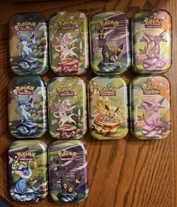 Pokemon TCG EMPTY Mini Tin Lot Of 104 Assorted With Art Card And Coin/Sticker - Image 1