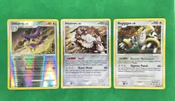 3x Pokemon Legends Awakened NM-Lot – Delcatty RH, Heatran Holo, Regigigas Holo - Image 1